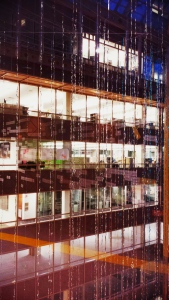 office building with window reflection and metallic streamers